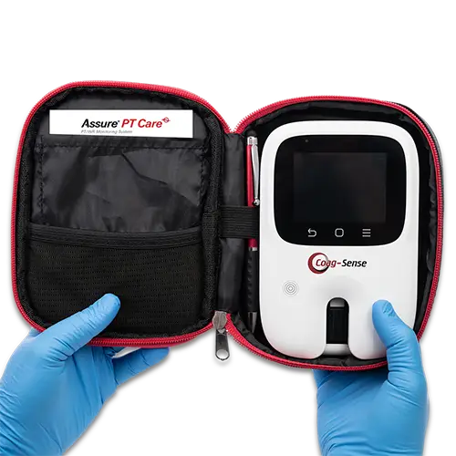 Hands holding Assure PT Care meter