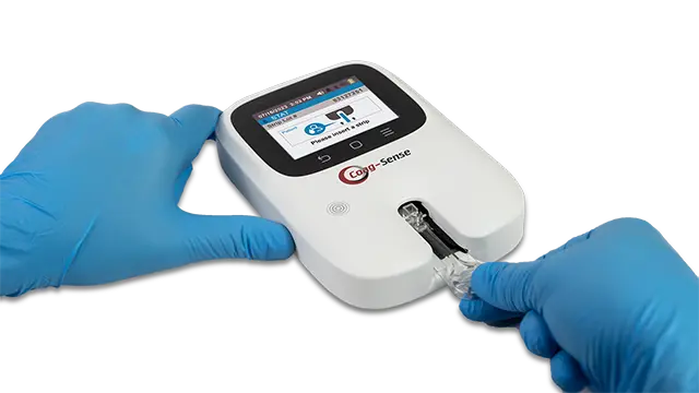 Step 1 Hand inserting test strip. Conducting a PT/INR test with the Assure PT Care Meter. ARKRAY USA, Inc.